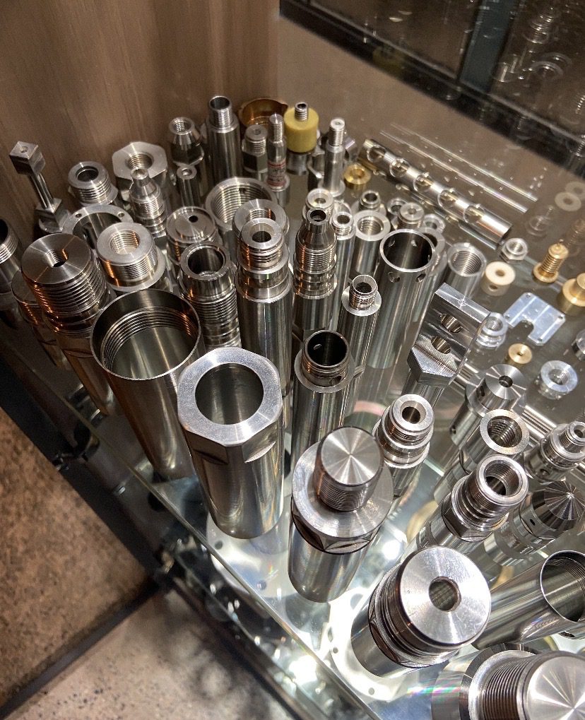 High-precision CNC machined Inconel 718 components showing complex geometries and tight tolerances for aerospace turbine applications.