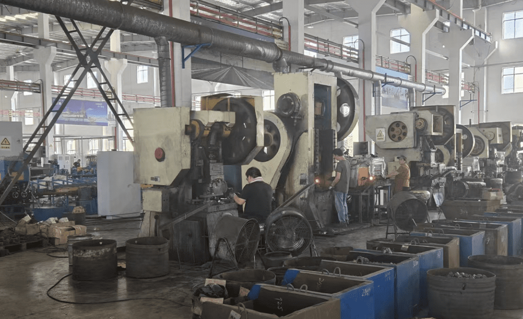 Industrial CNC machining center manufacturing high-precision Inconel and titanium fasteners in a professional factory setting